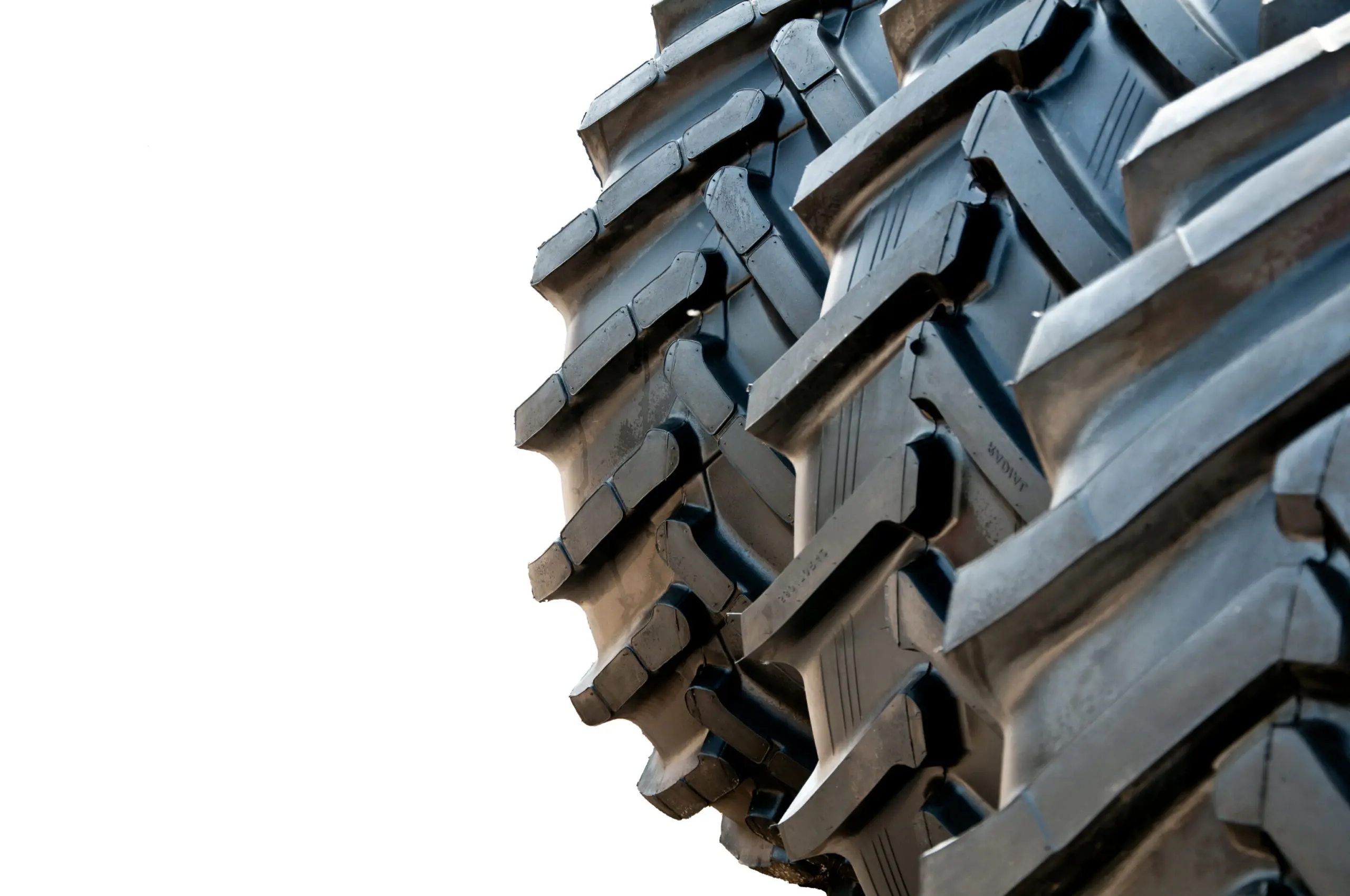 Stack of brand new tractor tires, isolated.